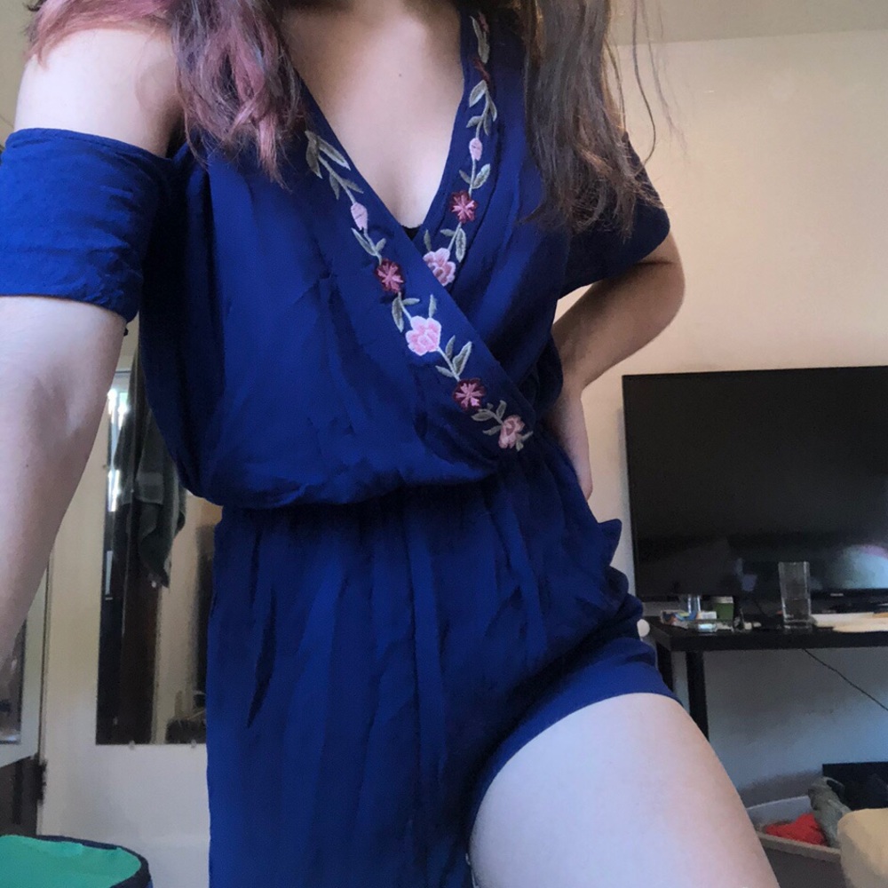 Francesca’s navy blue embroidered floral romper